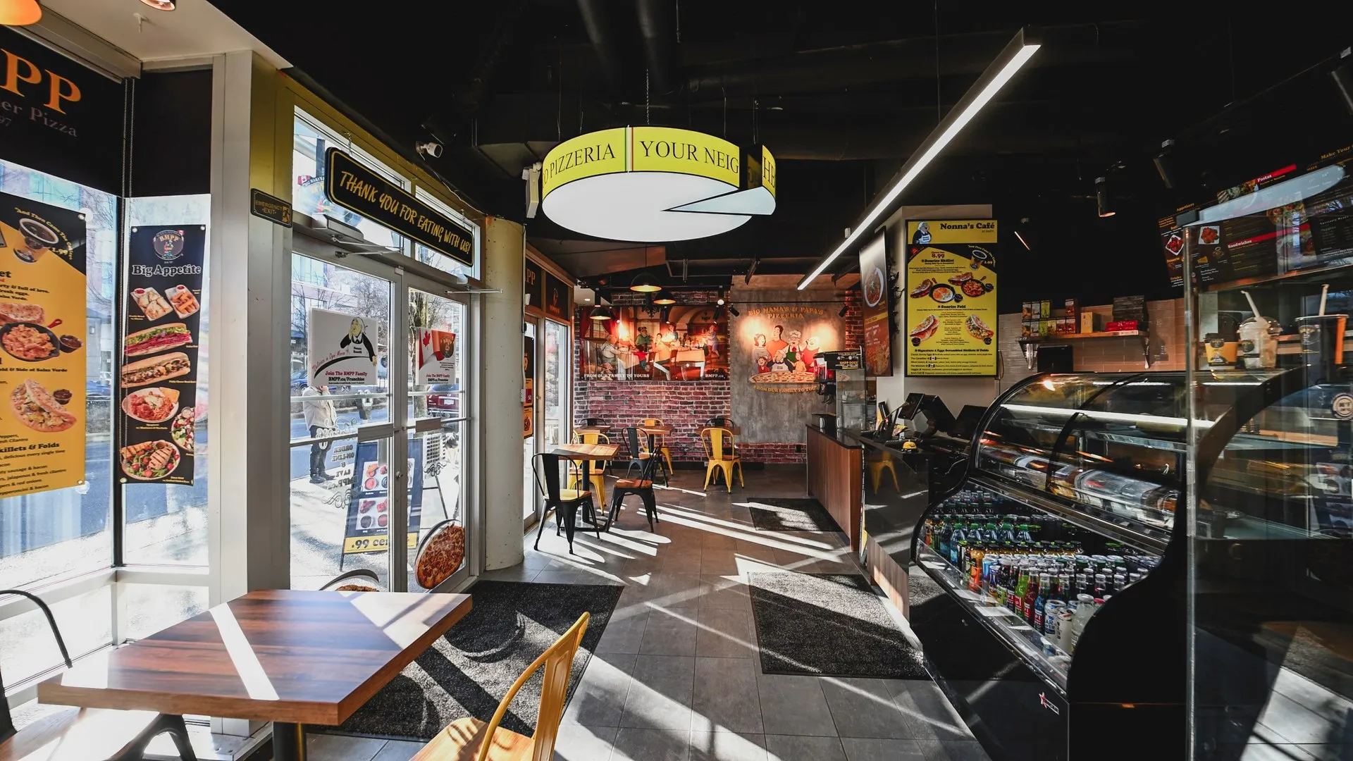 Pizzeria interior order counter, refrigerated beverage display and custom slice ceiling lamp — BIG MAMA'S & PAPA'S PIZZERIA — SURREY, BC
